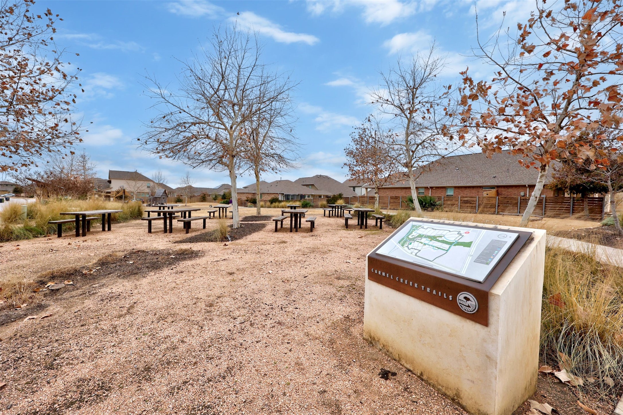 307 Simmental Loop Hutto, TX 78634 - Photo 33 of 34 Numerous picnic tables are thoughtfully placed throughout this community park, offering ample space for outdoor enjoyment.