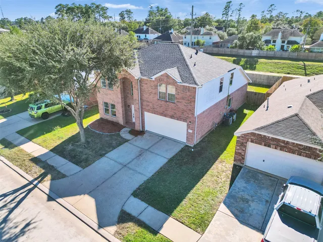 an aerial view of a house with garden