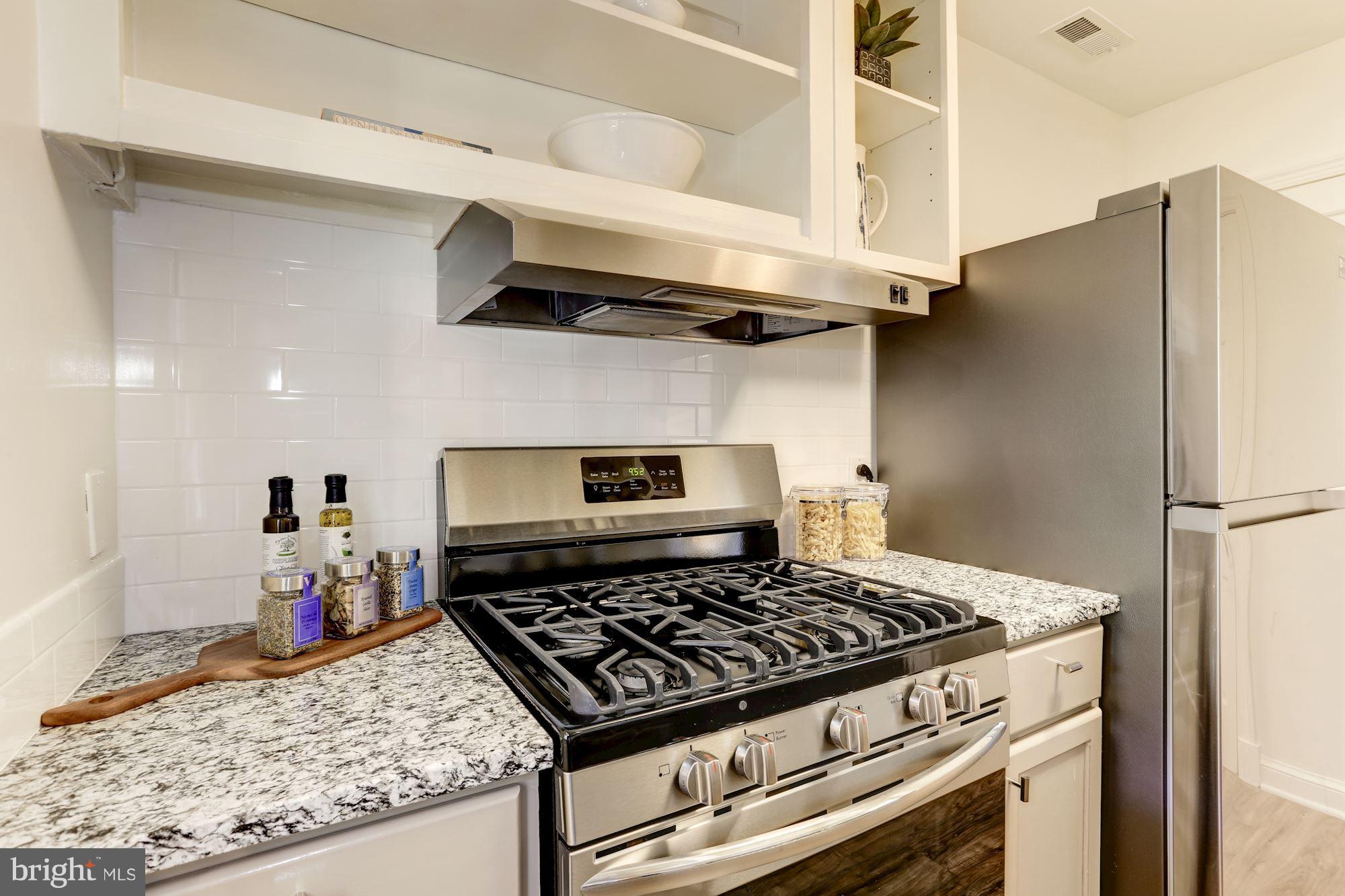 1358 Rittenhouse Street Northwest Washington, DC 20011 - Photo 12 of 30 a stove top oven sitting inside of a kitchen