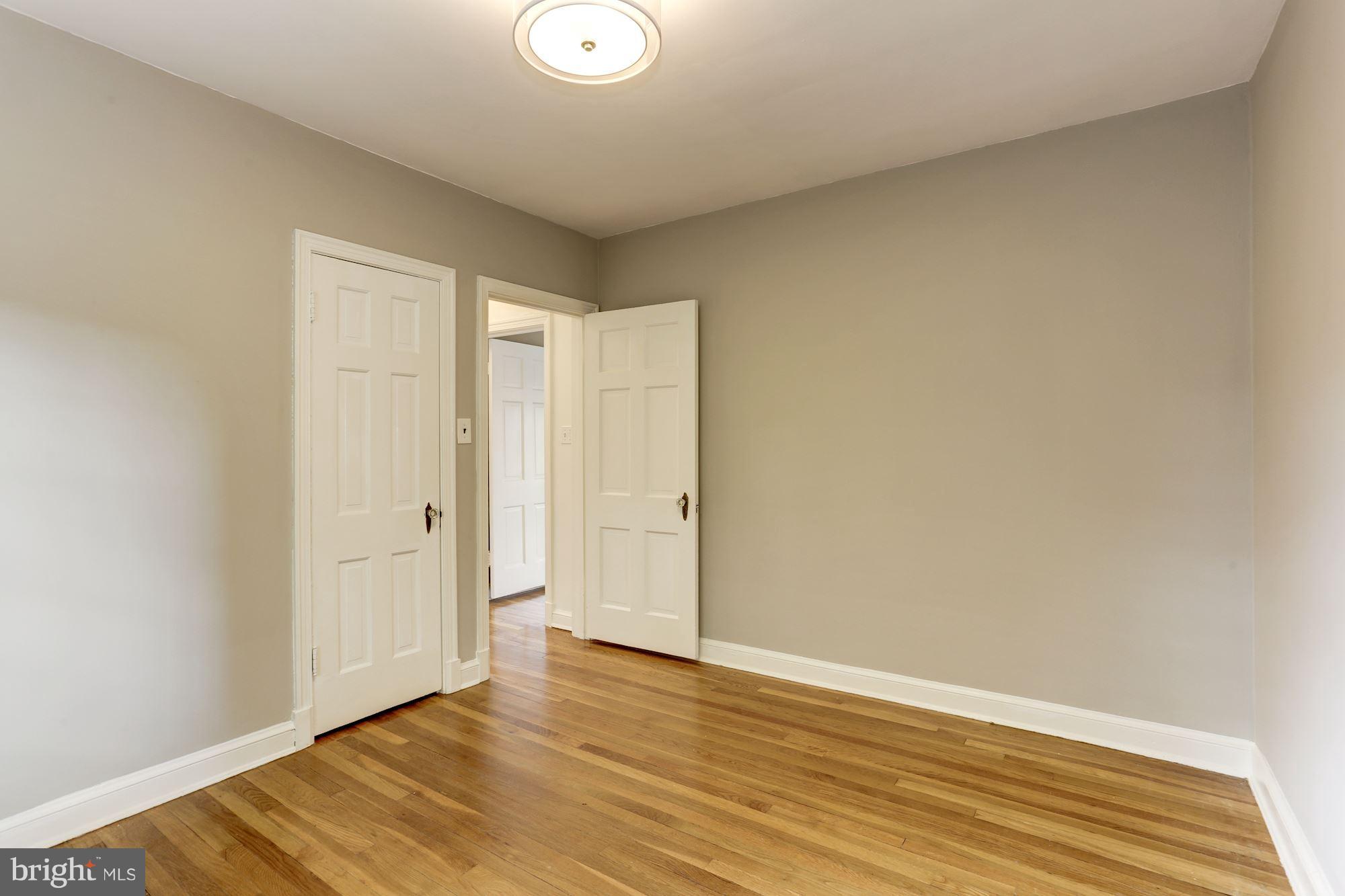 1358 Rittenhouse Street Northwest Washington, DC 20011 - Photo 21 of 30 a view of an empty room and wooden floor