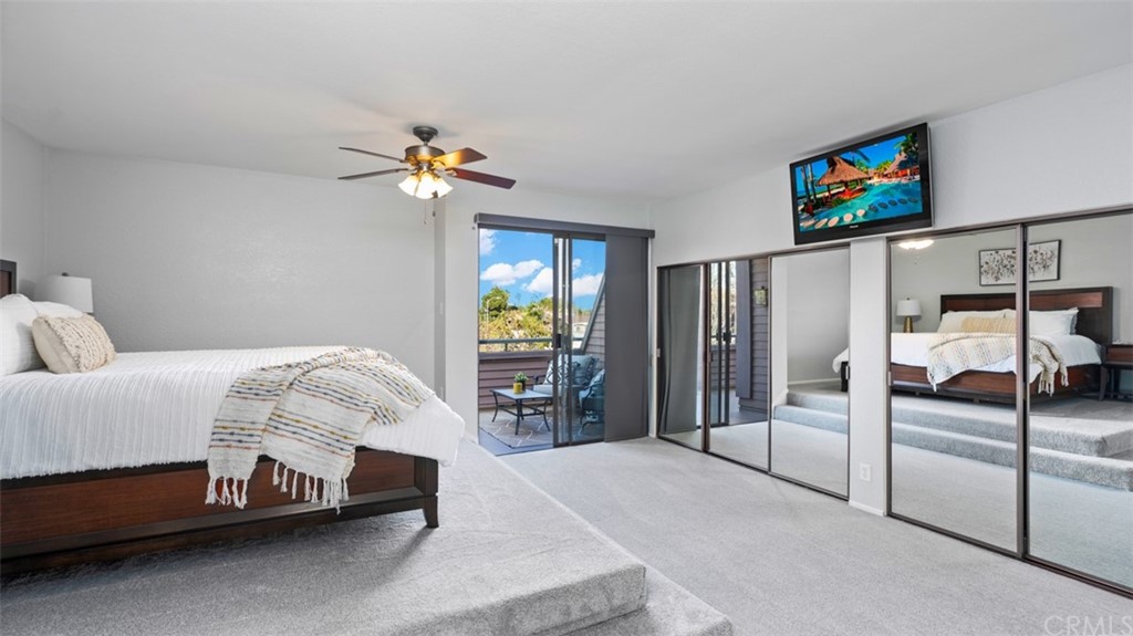 4555 Alla Road, Unit 3 Marina del Rey, CA 90292 - Photo 16 of 26 a bedroom with a bed and a chandelier