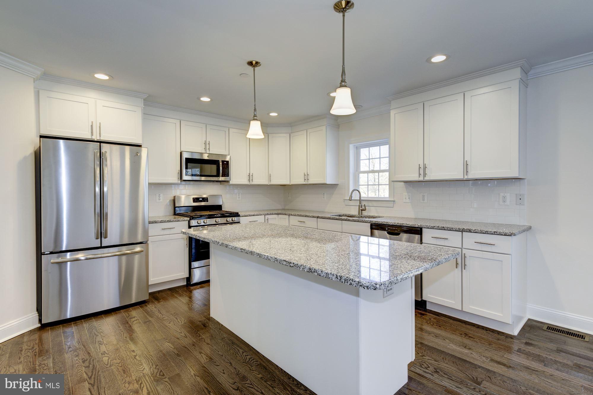 8311 Oakleigh Road Baltimore, MD 21234 - Photo 13 of 39 White Cabs, GE Stainless Steel Appliances