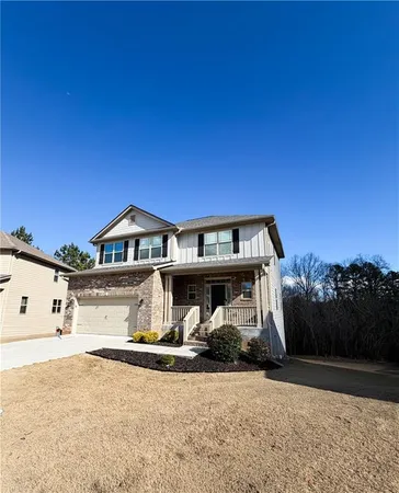 a front view of a house with yard