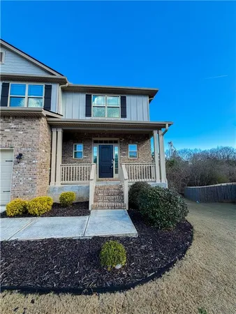 a front view of a house with garden