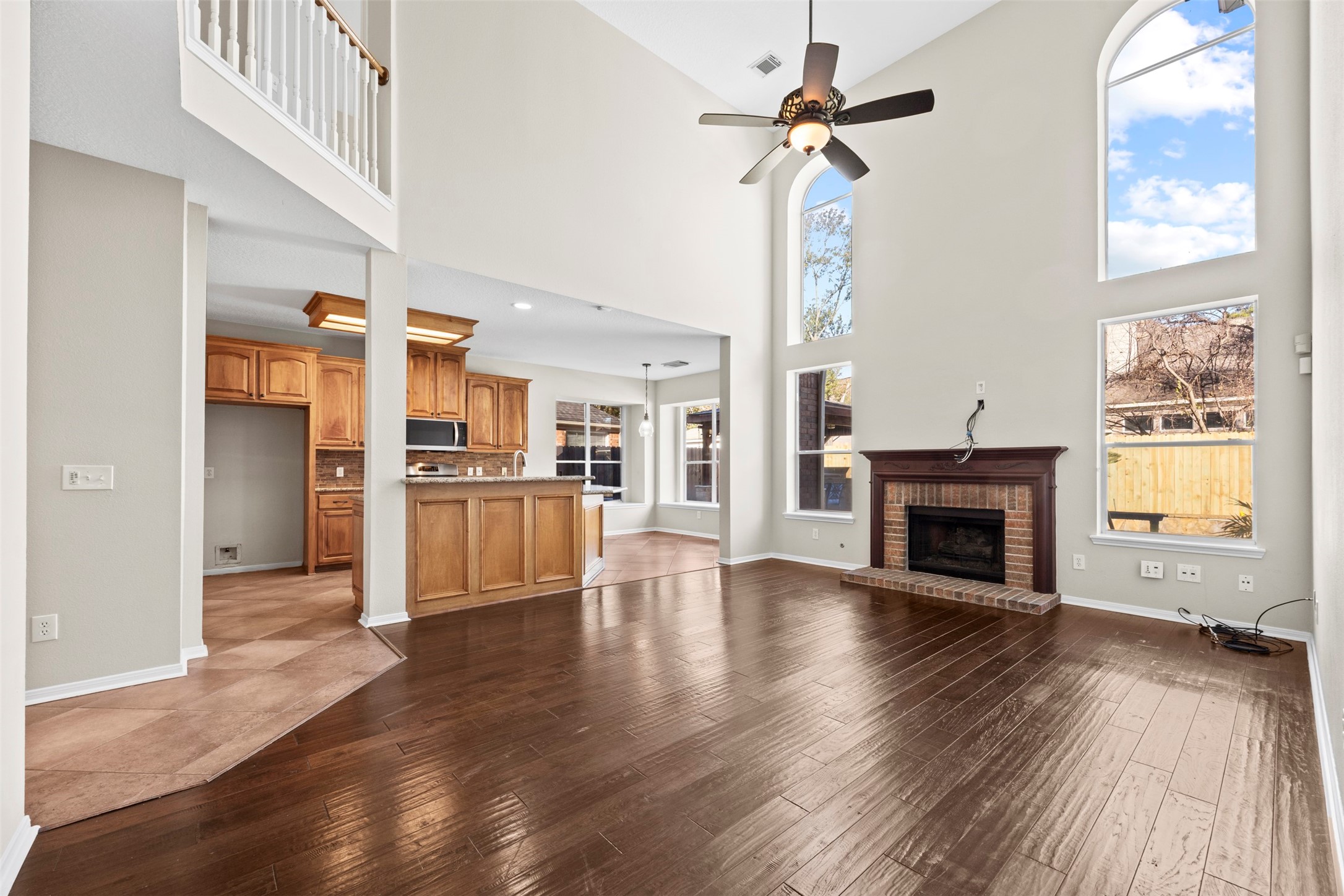 11118 Sprucedale Court Houston, TX 77070 - Photo 11 of 45 a view of an empty room with a window and wooden floor