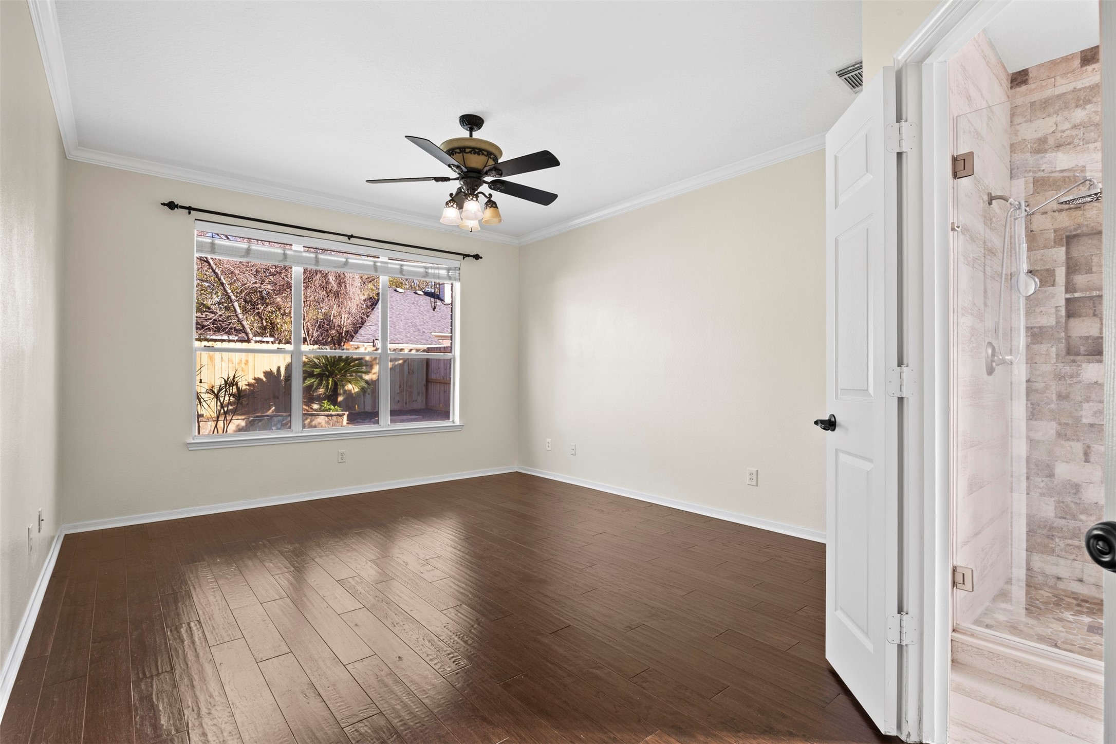 11118 Sprucedale Court Houston, TX 77070 - Photo 14 of 45 a view of empty room with wooden floor and fan
