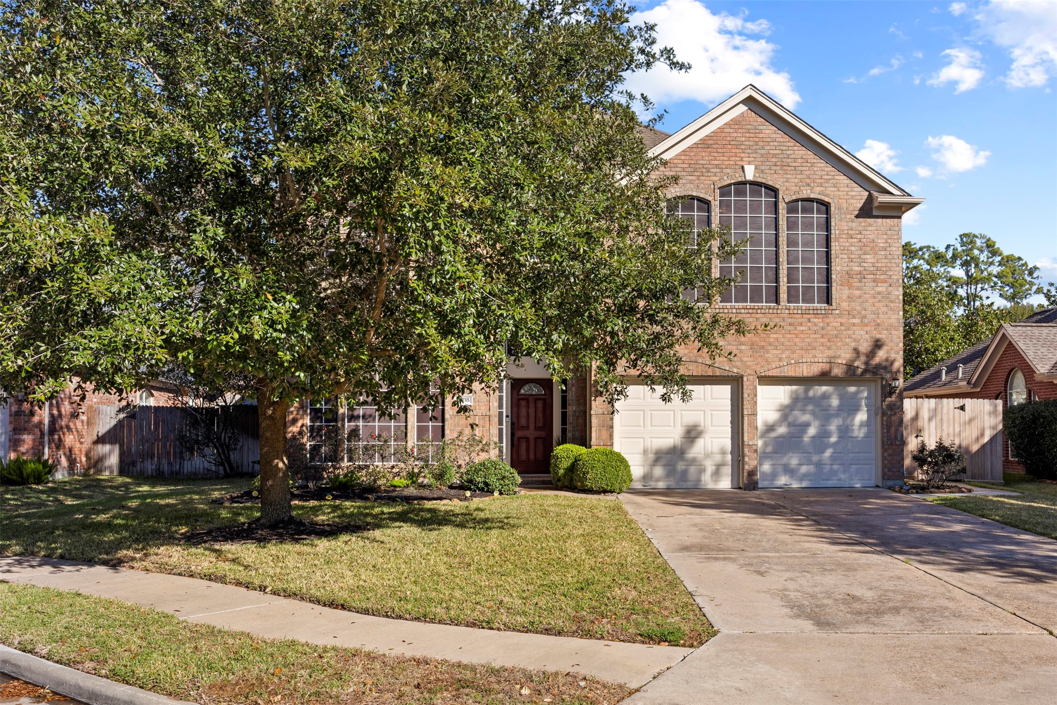 11118 Sprucedale Court Houston, TX 77070 - Photo 2 of 45 a front view of a house with a yard and tree s
