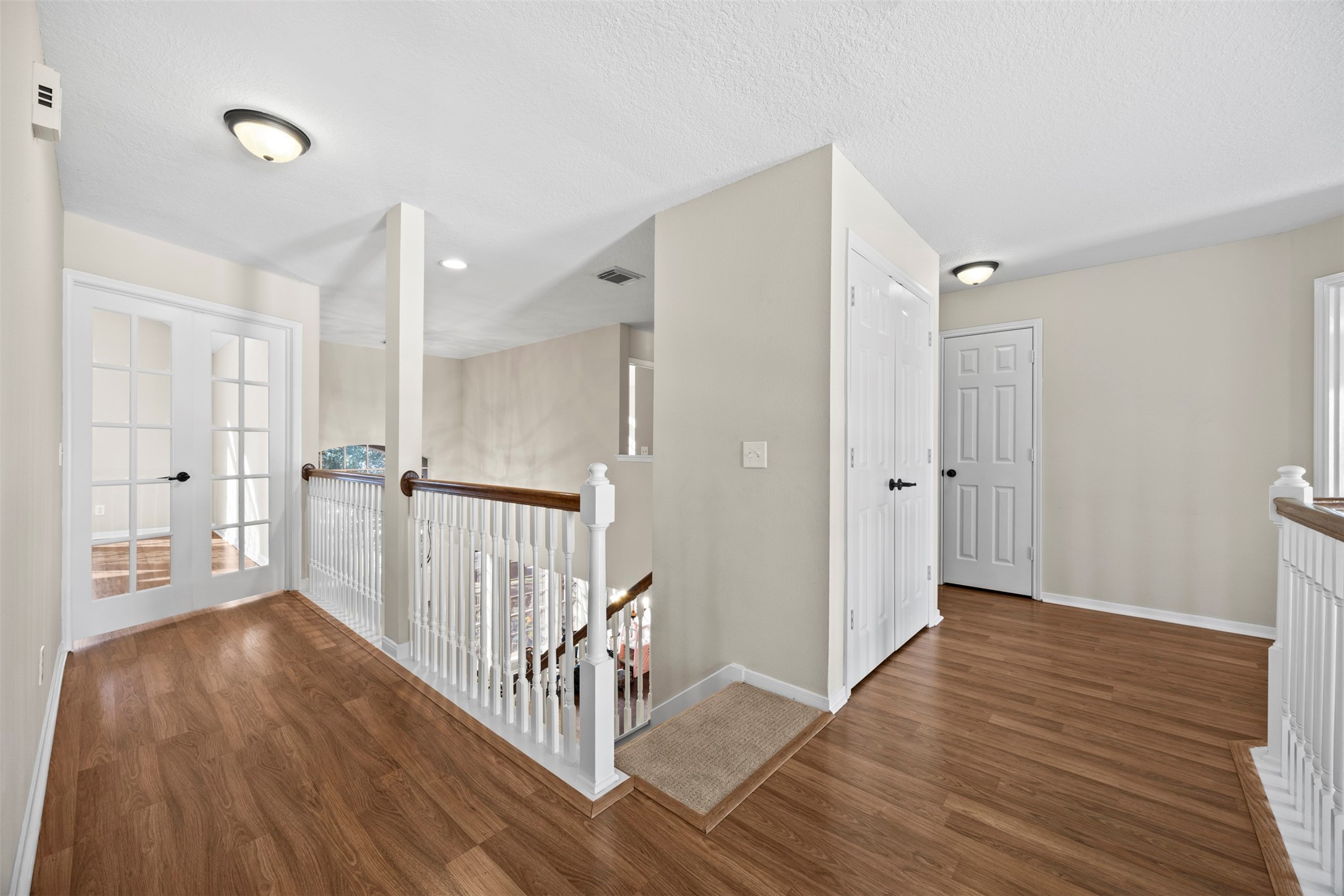 11118 Sprucedale Court Houston, TX 77070 - Photo 21 of 45 a view of a hallway with wooden floor