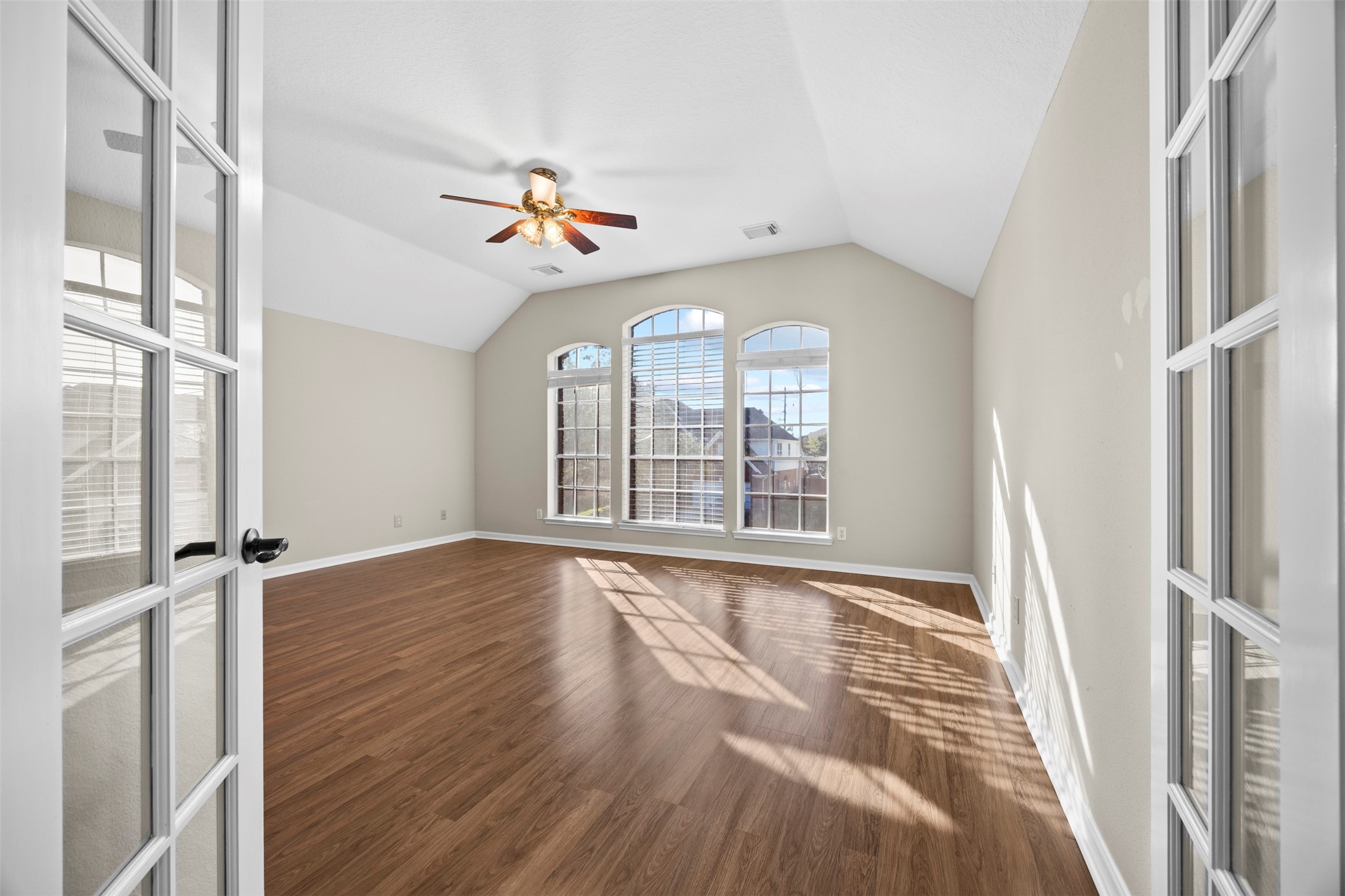 11118 Sprucedale Court Houston, TX 77070 - Photo 27 of 45 wooden floor in an empty room with a window