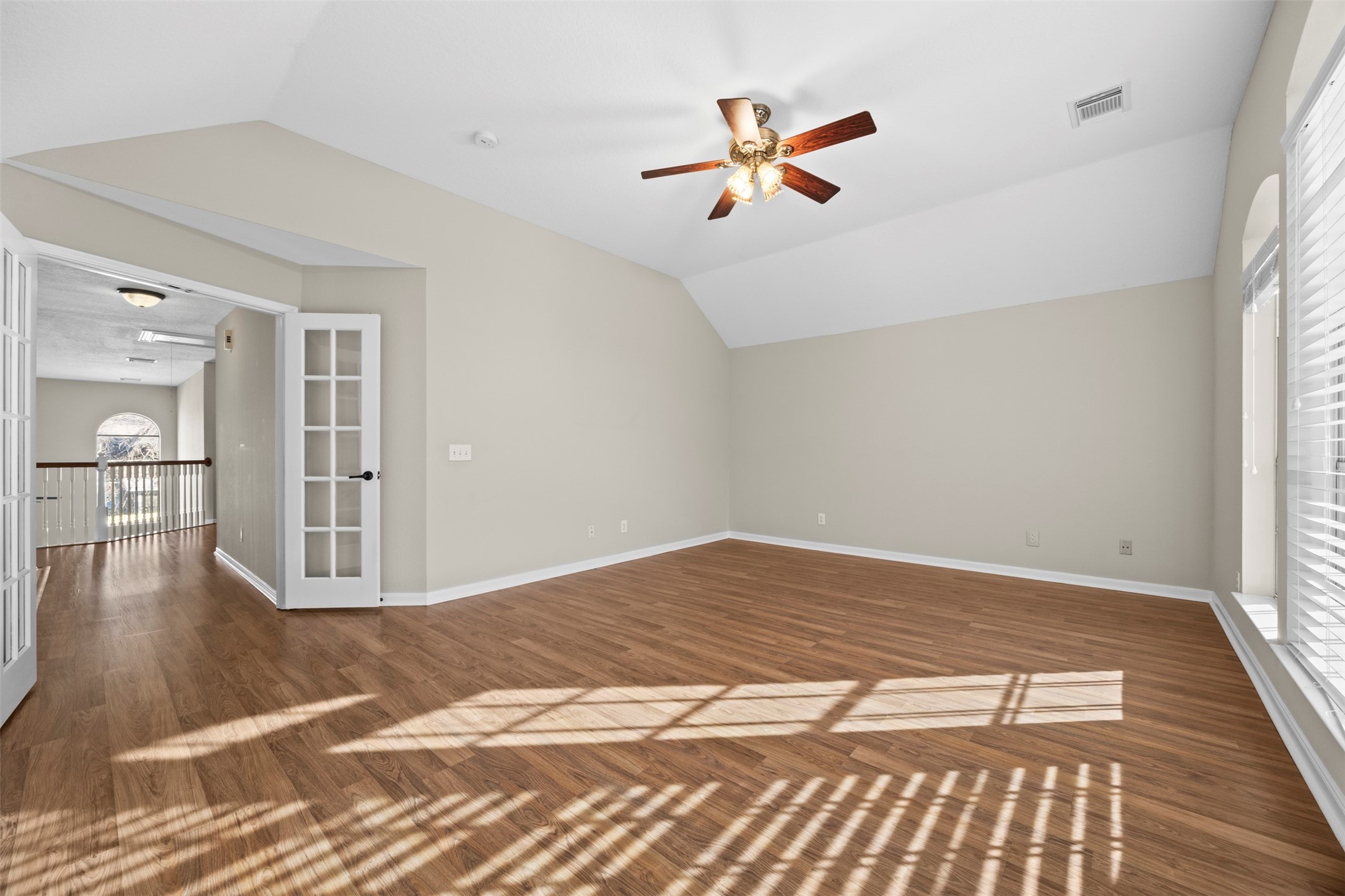 11118 Sprucedale Court Houston, TX 77070 - Photo 28 of 45 a view of empty room with wooden floor and fan