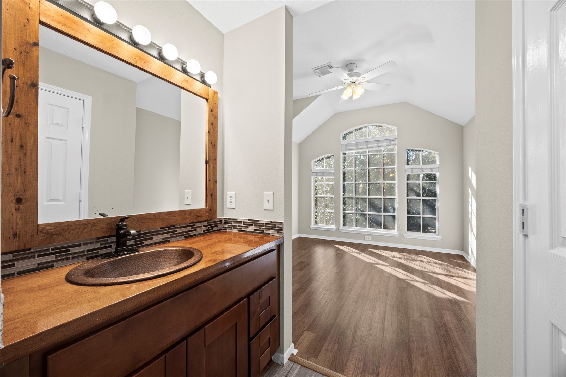11118 Sprucedale Court Houston, TX 77070 - Photo 32 of 45 a bathroom with a sink a vanity and a mirror