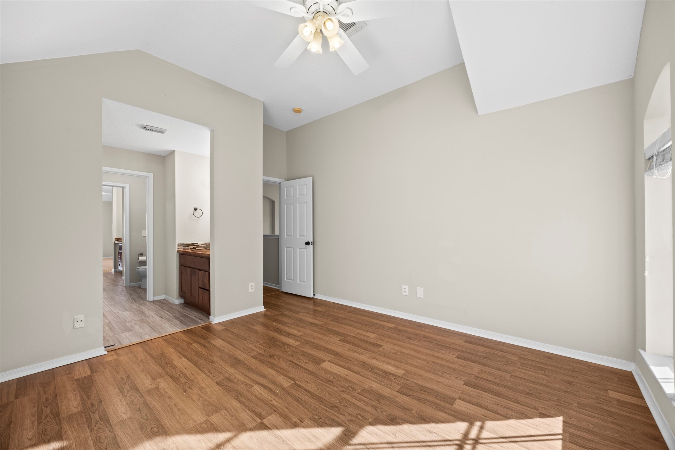 11118 Sprucedale Court Houston, TX 77070 - Photo 33 of 45 a view of an empty room with wooden floor