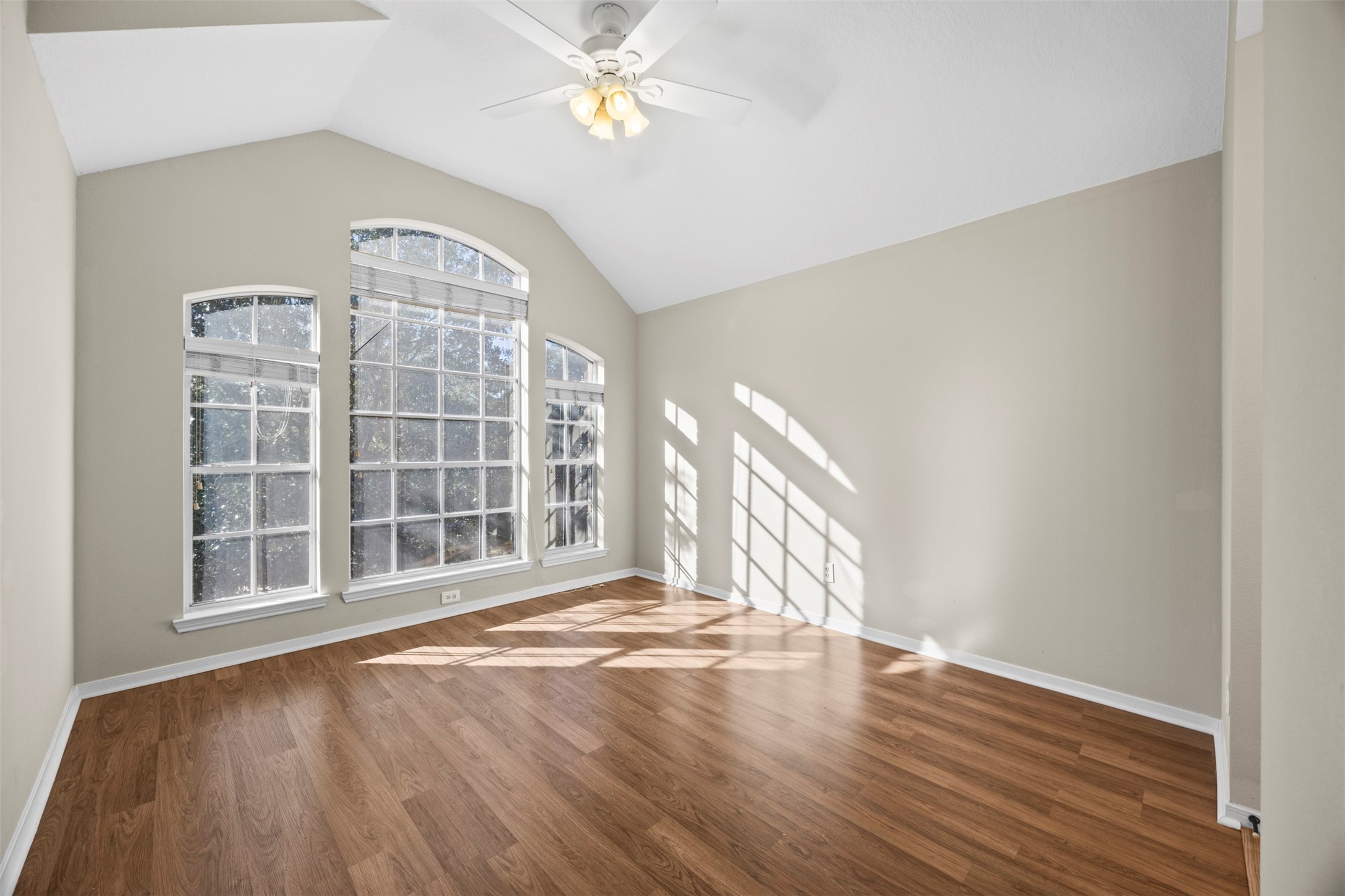 11118 Sprucedale Court Houston, TX 77070 - Photo 34 of 45 a view of an empty room with a window and wooden floor