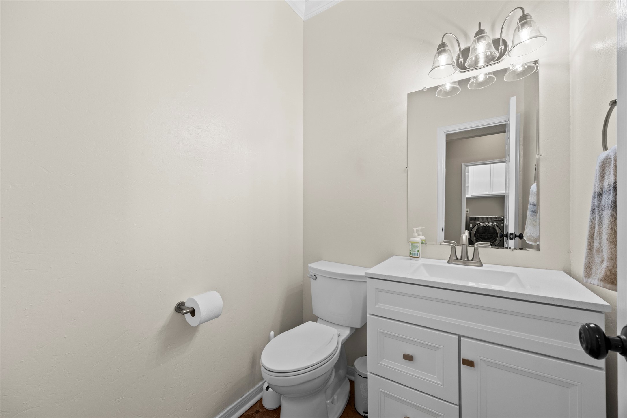 11118 Sprucedale Court Houston, TX 77070 - Photo 9 of 45 a bathroom with a toilet sink vanity and mirror