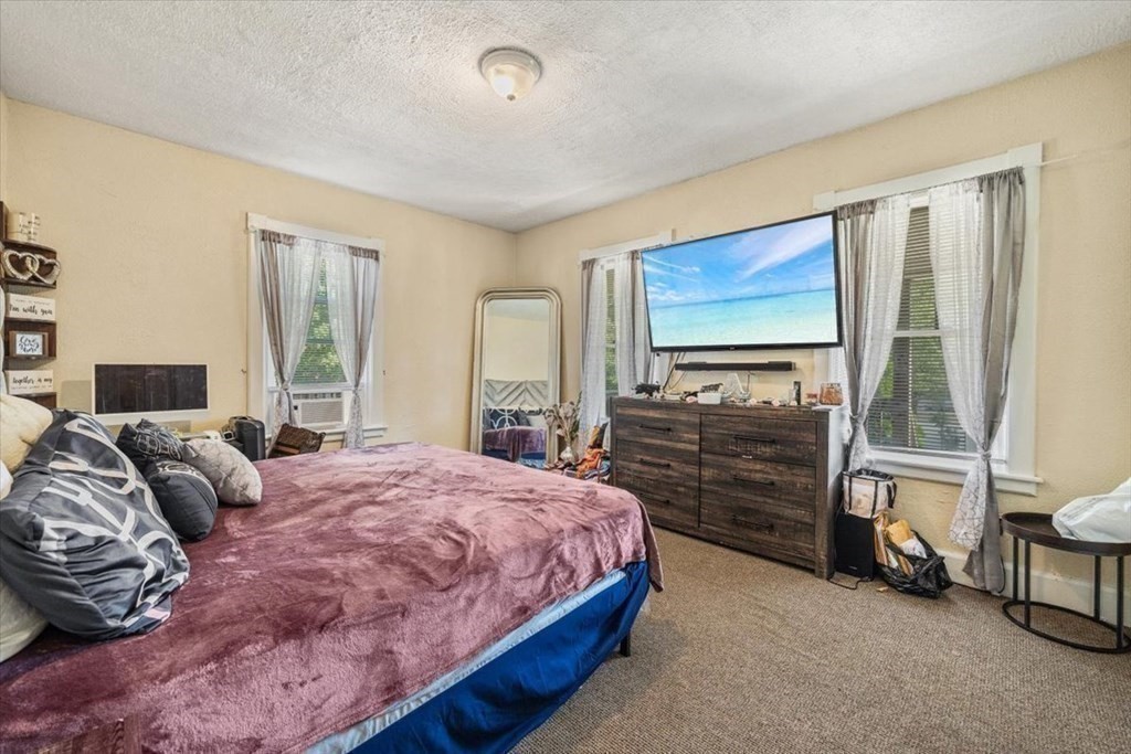 156 Allen Street Randolph, MA 02368 - Photo 11 of 26 a bedroom with a bed and a window