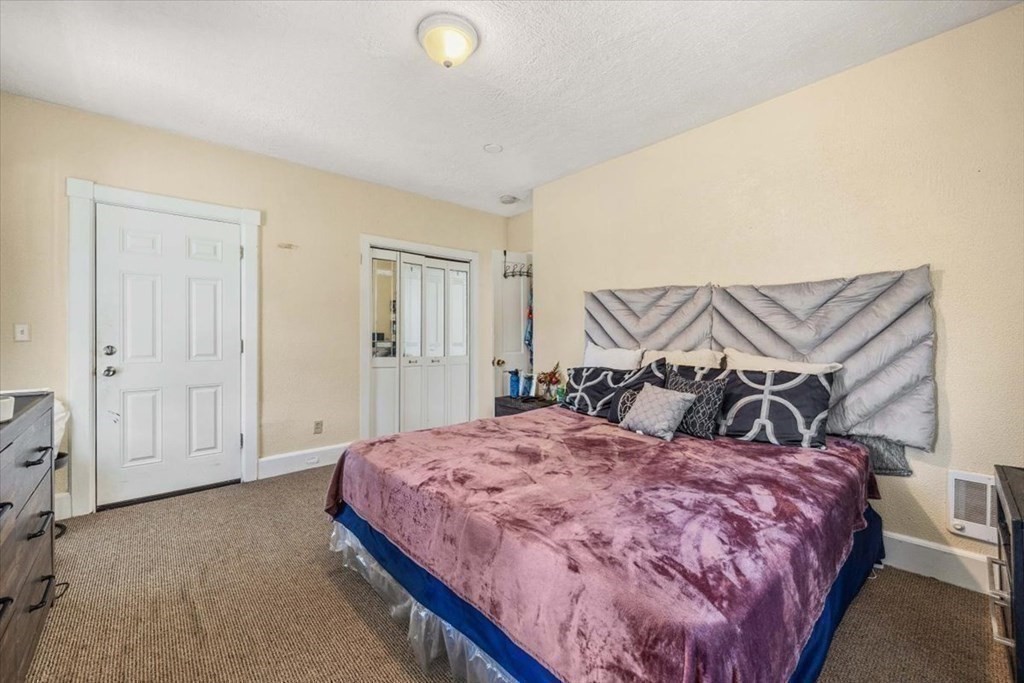 156 Allen Street Randolph, MA 02368 - Photo 12 of 26 a bedroom with a bed and closet