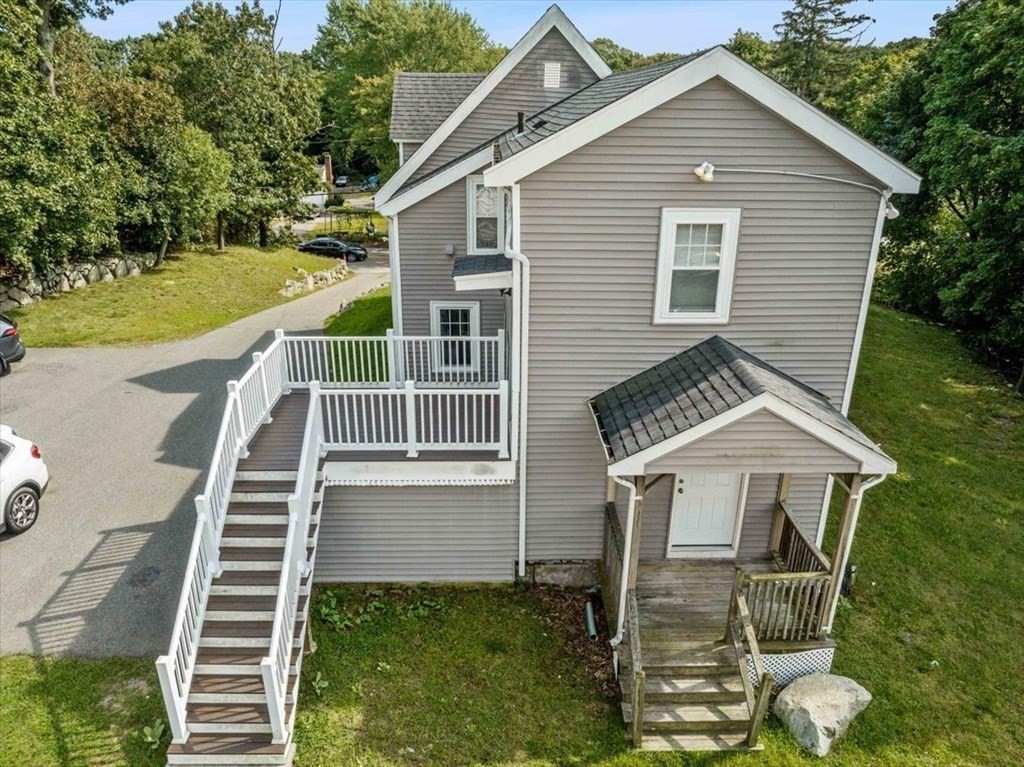156 Allen Street Randolph, MA 02368 - Photo 16 of 26 a front view of a house with a yard