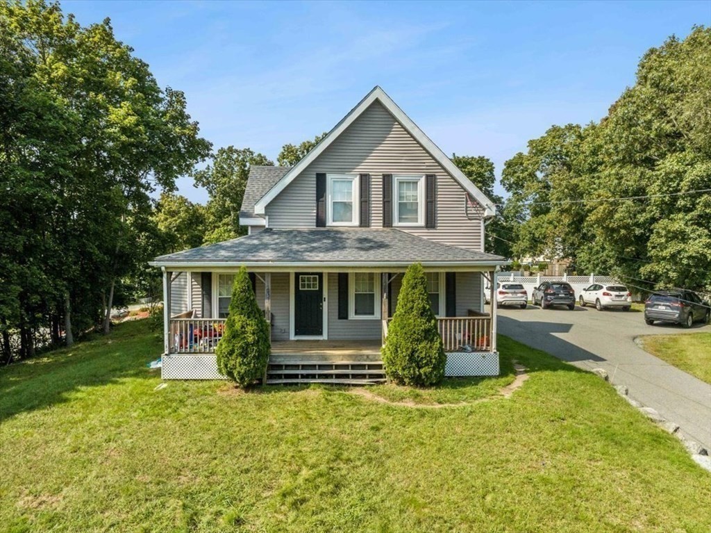 156 Allen Street Randolph, MA 02368 - Photo 3 of 26 a front view of a house with garden