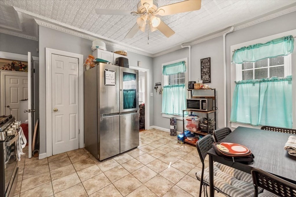 156 Allen Street Randolph, MA 02368 - Photo 6 of 26 a kitchen with stainless steel appliances granite countertop a refrigerator and a sink