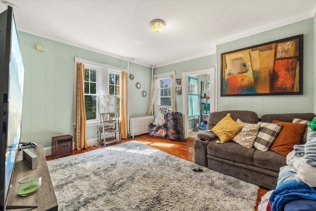 156 Allen Street Randolph, MA 02368 - Photo 7 of 26 a living room with furniture a rug and a window