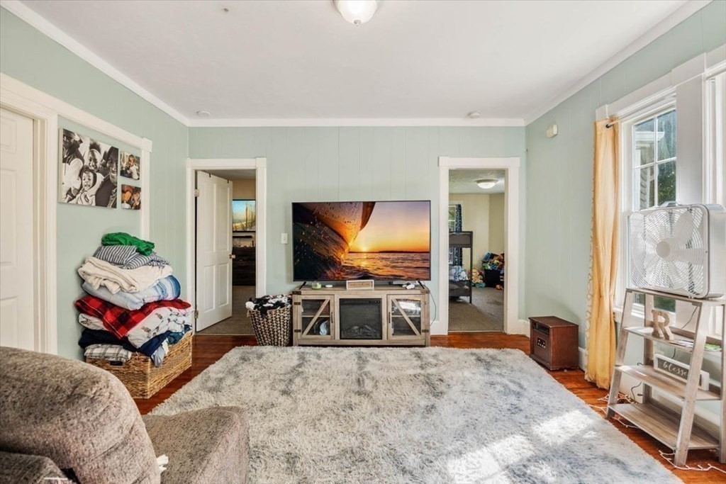 156 Allen Street Randolph, MA 02368 - Photo 9 of 26 a living room with furniture and a flat screen tv