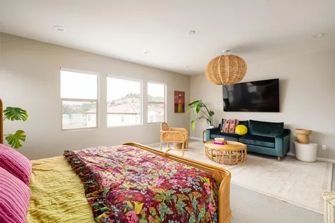 a bedroom with bed and a window