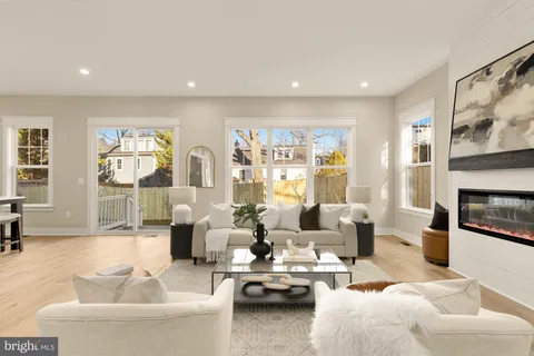 a large kitchen with a table and chairs in it