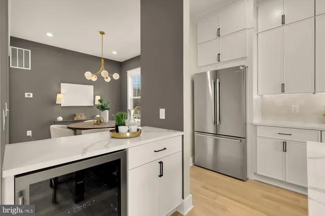 a view of a refrigerator in kitchen