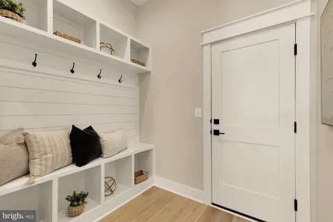 a en suite bathroom with a double vanity sink a toilet and a mirror