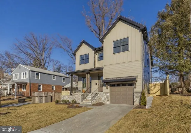 a view of a white house with large windows