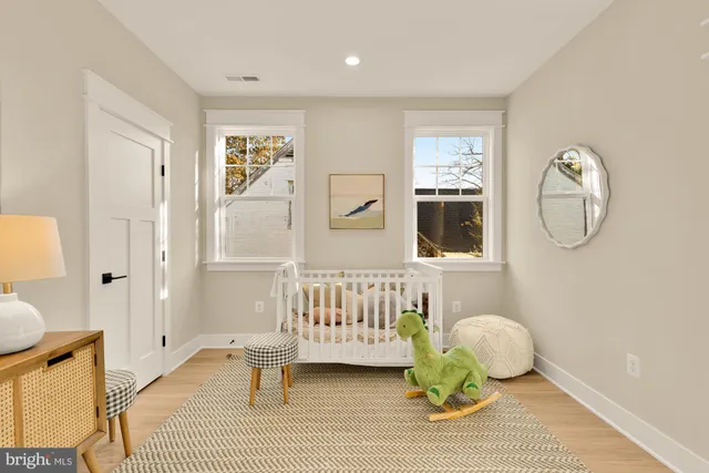 a bedroom with a large bed and a mirror