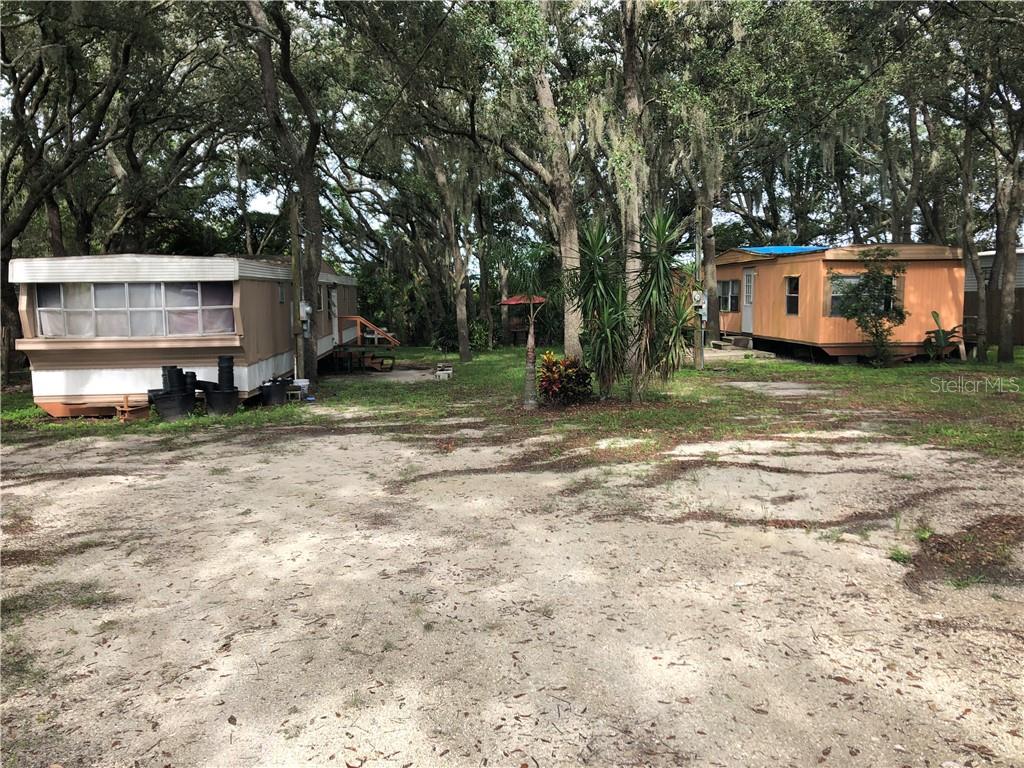 4968 Avon Park Cut Off Road Avon Park, FL 33825 - Photo 1 of 1 a view of a house with a yard