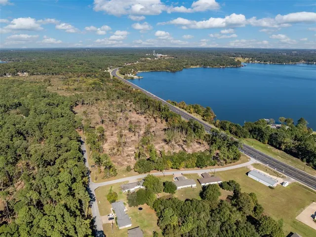 a view of a lake with a yard