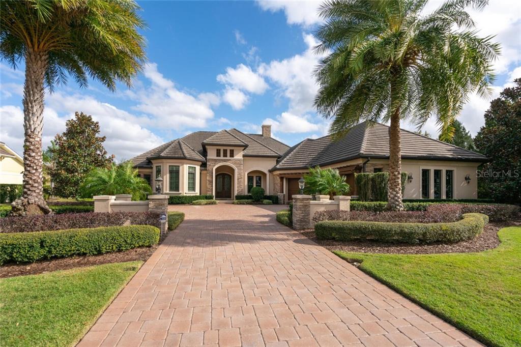 French Country Masterpiece!  Incredible features throughout, including: Low-E, impact sliding doors, Platinum Control 4 home automation, Levitron systems, Generac Generator, & Florida Green Builder Certified!!