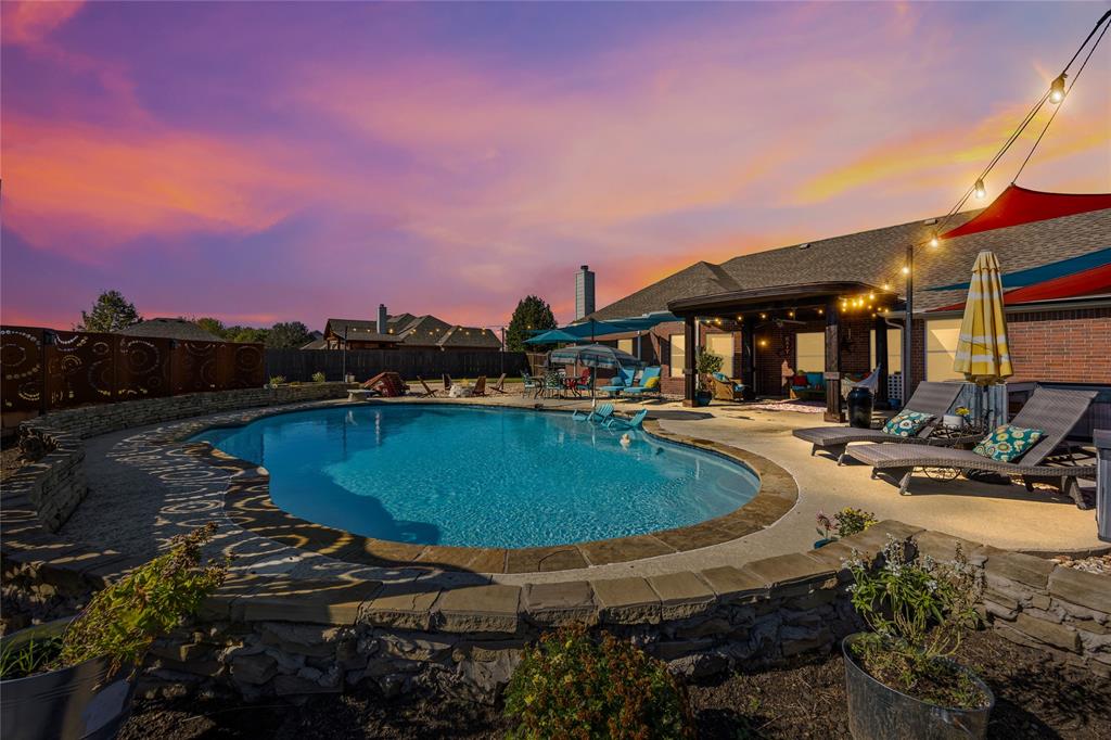 112 Springfield Lane Red Oak, TX 75165 - Photo 1 of 40 a view of a swimming pool with a table and chairs