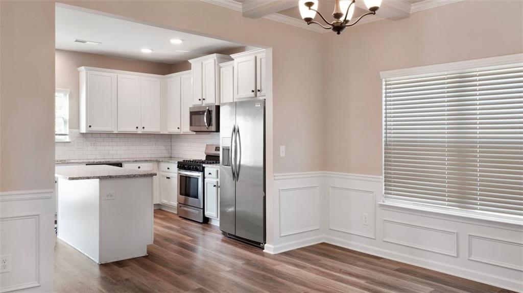 4906 Zoya Court Atlanta, GA 30331 - Photo 19 of 22 a kitchen with stainless steel appliances granite countertop a refrigerator and a stove top oven