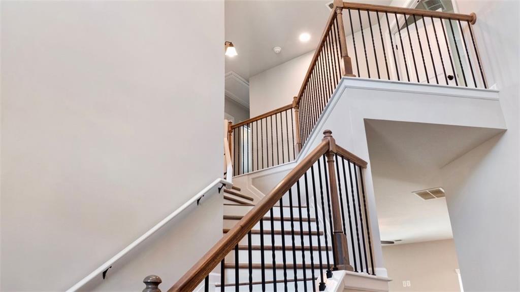 4906 Zoya Court Atlanta, GA 30331 - Photo 10 of 22 a view of staircase with railing and white walls