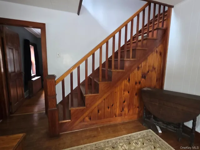 a view of entryway with wooden floor