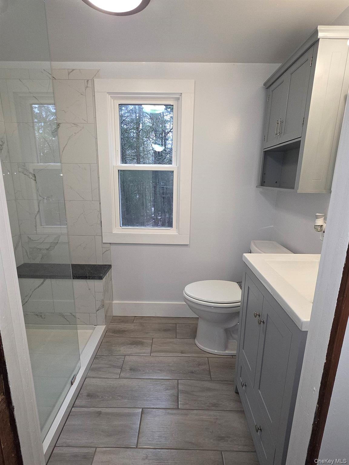 27 Airport Road Eldred, NY 12732 - Photo 24 of 28 a bathroom with a toilet a sink and a shower
