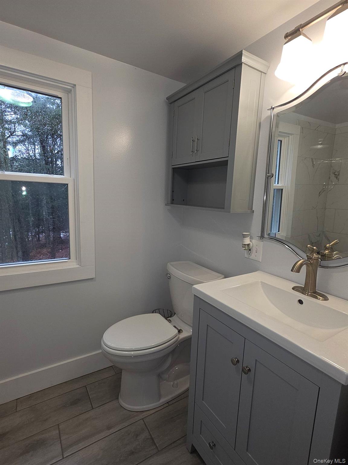 27 Airport Road Eldred, NY 12732 - Photo 26 of 28 a bathroom with a sink toilet and window