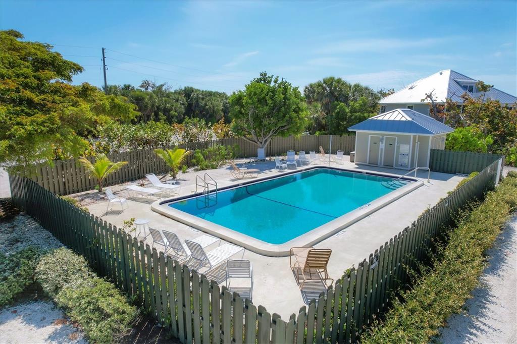 480 Gulf Boulevard, Unit 6 Boca Grande, FL 33921 - Photo 11 of 49 a view of a house with pool and yard