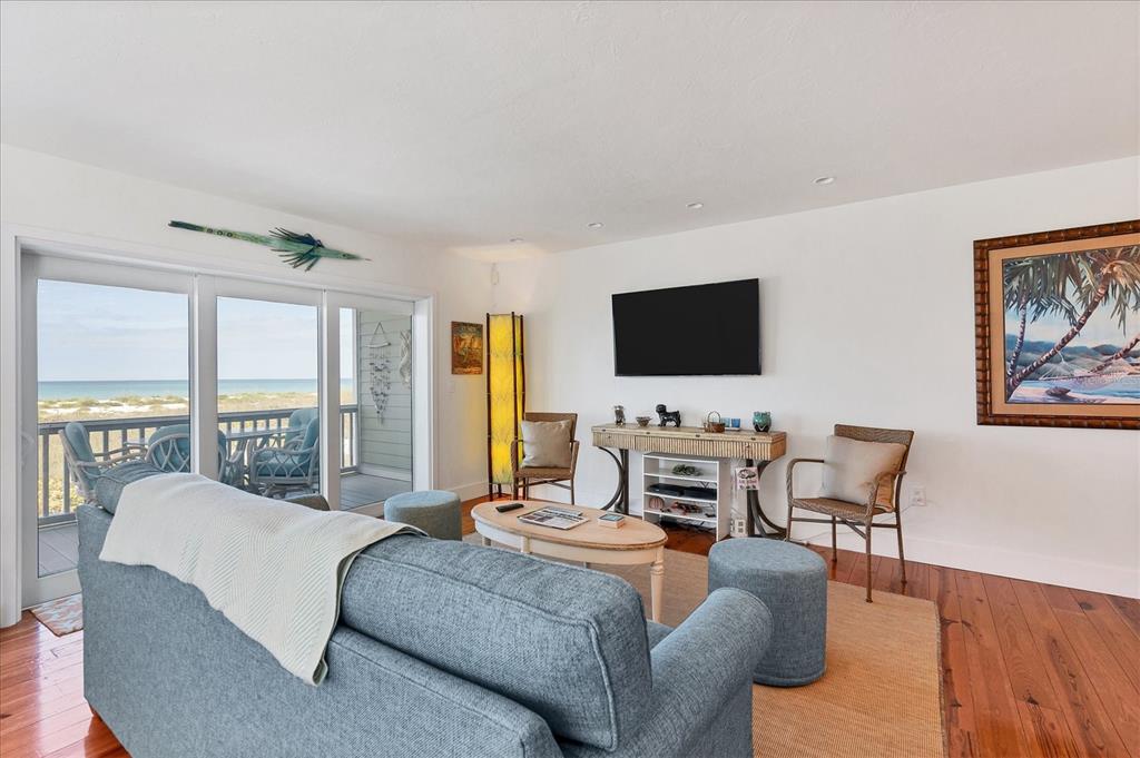 480 Gulf Boulevard, Unit 6 Boca Grande, FL 33921 - Photo 15 of 49 a living room with furniture and a flat screen tv