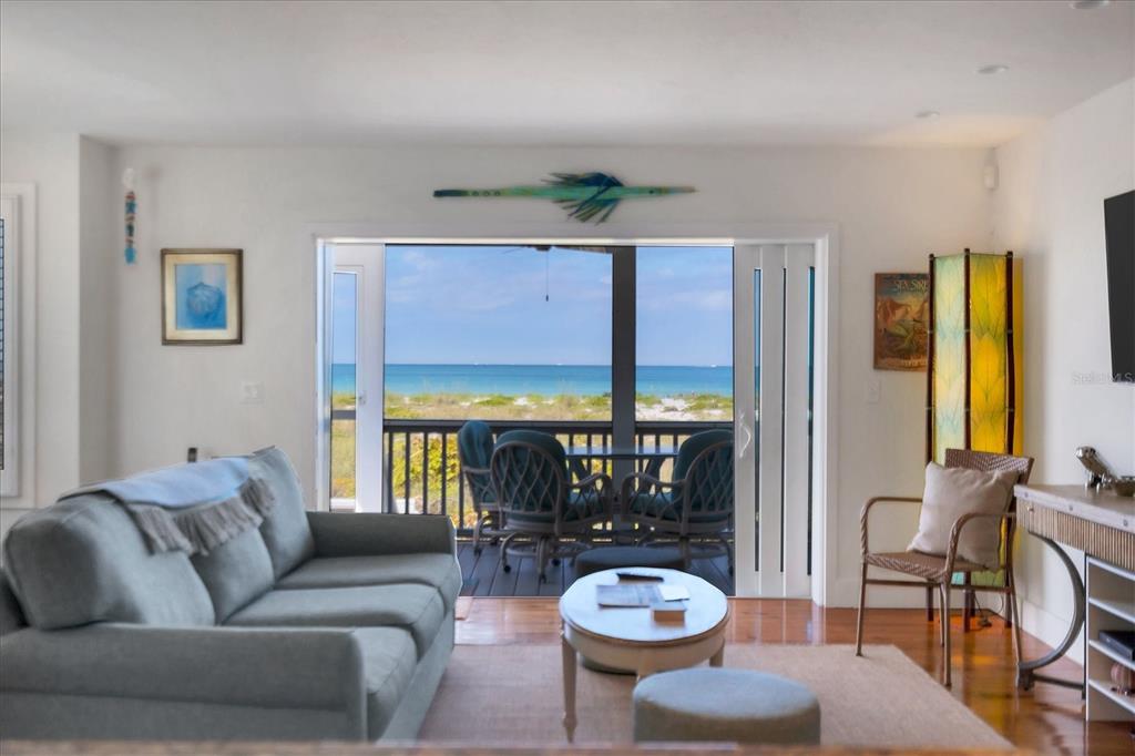 480 Gulf Boulevard, Unit 6 Boca Grande, FL 33921 - Photo 16 of 49 a living room with furniture and a large window