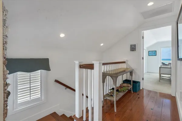 a view of entryway and hall with wooden floor
