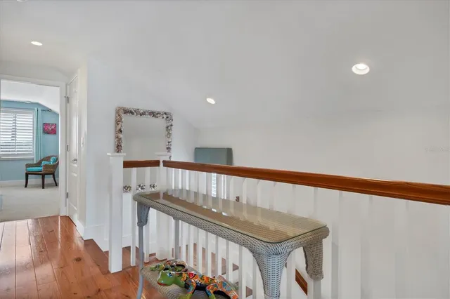 a view of an entryway with wooden floor