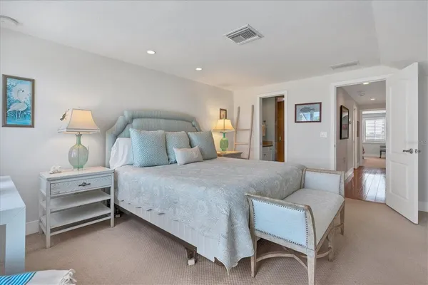 a bedroom with bed and a table