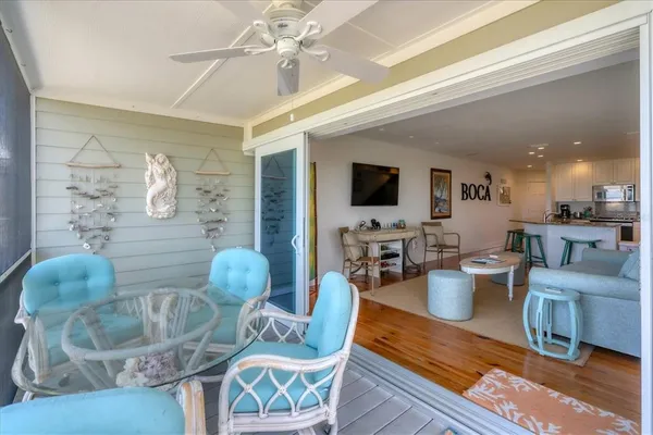 a living room with furniture and flat screen tv