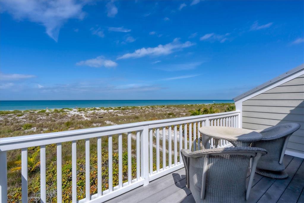 480 Gulf Boulevard, Unit 6 Boca Grande, FL 33921 - Photo 38 of 49 a view of a balcony with wooden floor and fence
