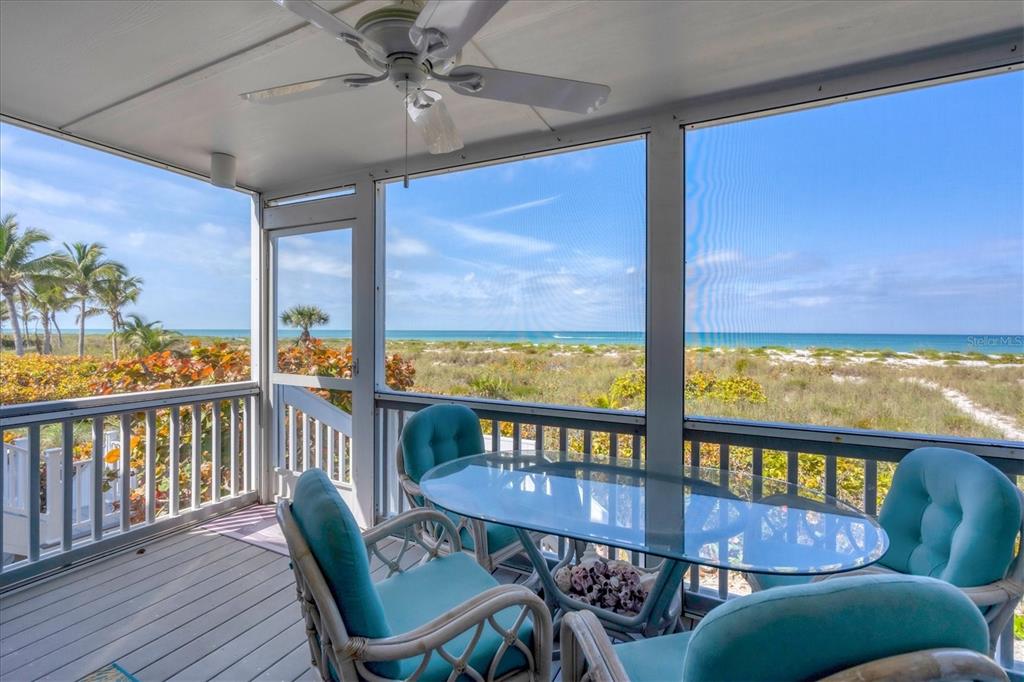 480 Gulf Boulevard, Unit 6 Boca Grande, FL 33921 - Photo 40 of 49 a view of a city from a balcony with furniture