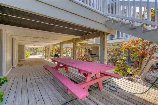 a view of a patio with wooden floor